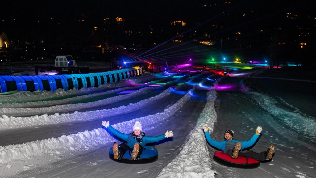 snow tubing under led lights